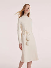 a woman in white jersey dress